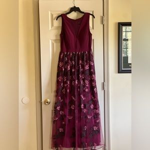 Elegant burgundy NW gown with flowered lace overlay